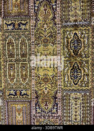 Close-up of a richly textured, repeating medallion carpet pattern Stock Photo
