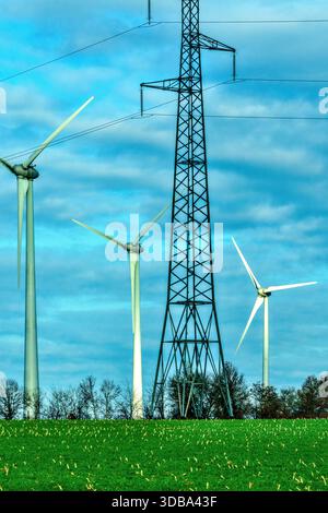 Wind turbines and tall high-voltage electricity pylon - Chatellerault, Vienne (86), France. Stock Photo