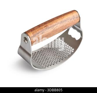 Manual stainless steel garlic press with wooden handle isolated on white background, clipping path included. Stock Photo