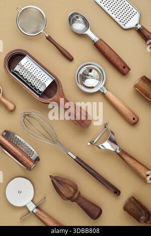Various kitchen utensils or cooking tools on brown background, top view, flat lay Stock Photo