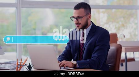 Young businessman using laptop in office. Concept of search Stock Photo