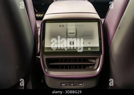Rear seat and climate control screen of a second-generation (E29) XPeng P7 4WD Performance version on an official test drive in Zhejiang Province, Chi Stock Photo