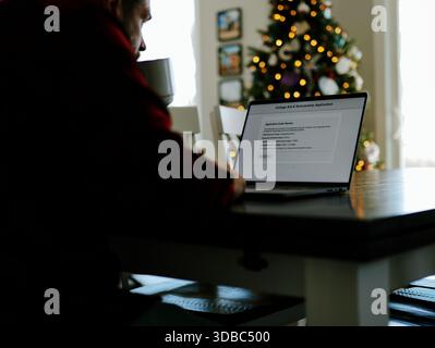 Middle Aged Man Applies for Student Loan Financial Aid and Scholarships - Never Too Late to Return to School - Adult Higher Education Growth Concept Stock Photo