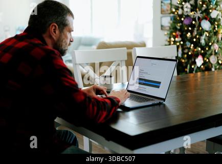 Middle Aged Man Applies for Student Loan Financial Aid and Scholarships - Never Too Late to Return to School - Adult Higher Education Growth Concept Stock Photo