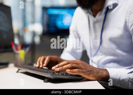 Close up of computer scientist using AI chatbot to review code file for bugs. IT expert using artificial intelligence to suggest optimizations and speed up application performance Stock Photo