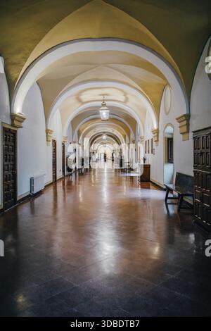 Arched Corridor with Vaulted Ceiling in an Old Spanish Monastery de Piedra Hallway Stock Photo