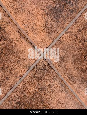 Aerial view of geometric patterns formed by terracotta tiles with contrasting grout lines creating a textured surface, Algarve, Faro District, Portuga Stock Photo