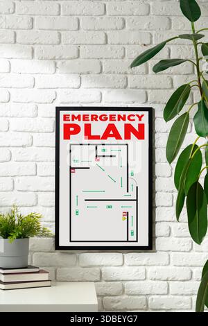 Emergency plan displayed on a wall with clear directions for safety and evacuation Stock Photo