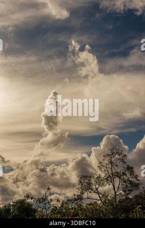 Cloud formation under the light of the sunset, in a forest in the eastern Andean mountains of central Colombia, near the Iguaque natural reserve. Stock Photo