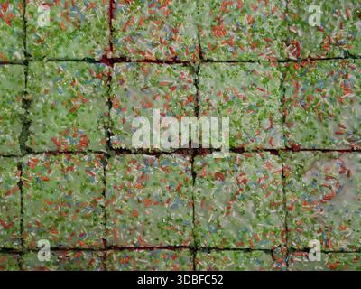 Parrot cake cut into even squares. Green icing with colorful sugar sprinkles, photographed from above. Copyspace. Stock Photo