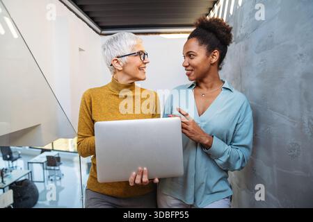 Business people with laptop, innovation in research and programming for future app technology Stock Photo