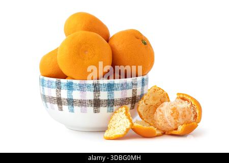 Delicious peeled ripe mandarin oranges in a bowl isolated on white background. Tropical fruits Stock Photo