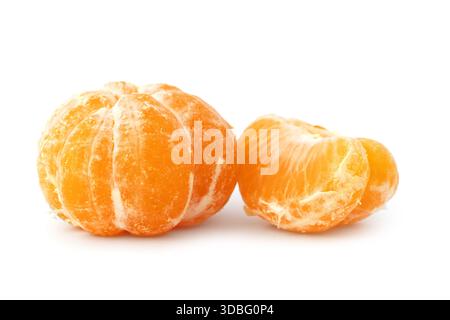 Whole and sliced tangerines with green leaf on black background mandarin orange Stock Photo