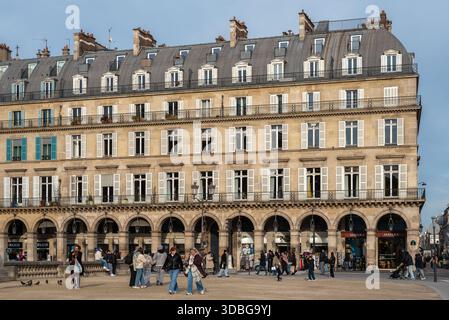 Beautiful traditional apartments on rue de Rivoli in the 1st arrondissement of Paris. Beautiful arches with hanging lantern lights Stock Photo