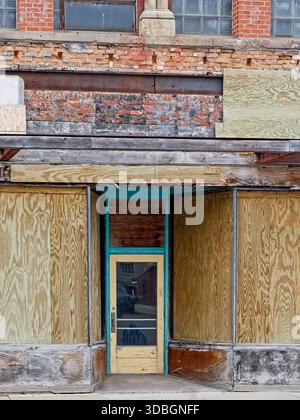 Restoration of vacant storefront in 1925 brick faced concrete building Stock Photo