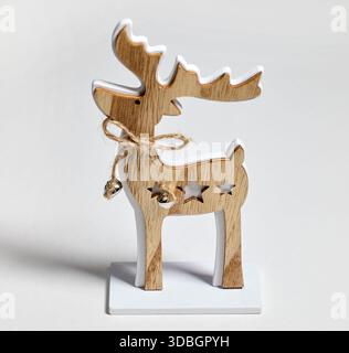 wooden Christmas decoration deer on light grey background Stock Photo