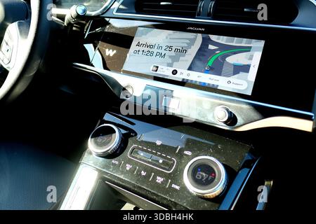 Console on a Waymo autonomous driverless robotaxi with map and trip information; estimated time of arrival, minutes left to destination; car interior. Stock Photo