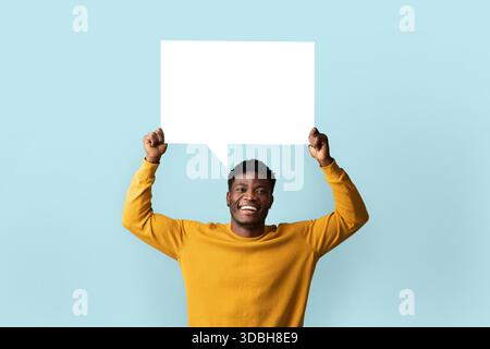 Cheerful black man holding empty communication chart Stock Photo