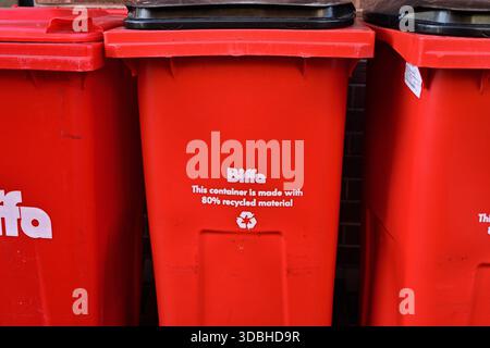 Lichfield, UK - December 10, 2025: Red Waste Bins Made From Recycled Plastic Material UK Stock Photo