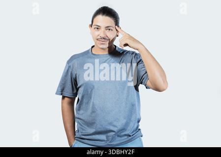 Pensive asian man with doubtful expression isolated. Thoughtful guy looking at camera isolated Stock Photo