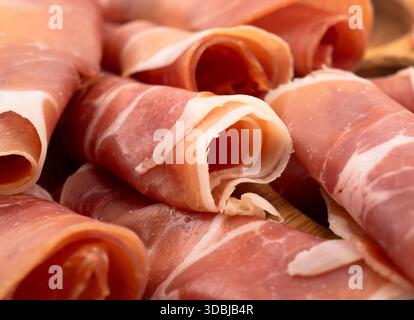 Jamon serrano. A Spanish ham texture background. Traditional spanish jamon sliced. Dry cured meat ham hamon iberico Stock Photo