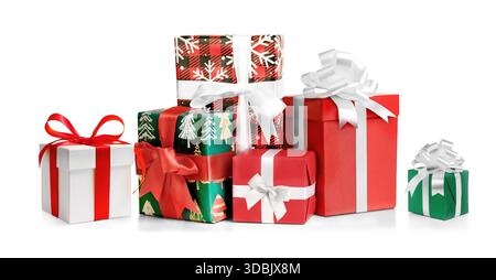 Different red, green and white Christmas gift boxes stacked on a white background Stock Photo