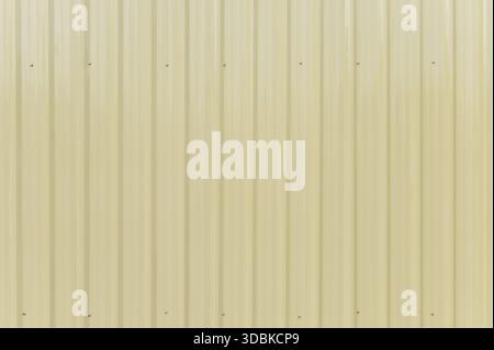 Pale yellow corrugated metal sheet background texture Stock Photo