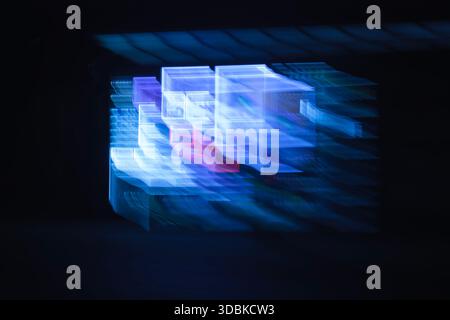 A futuristic background with a blue and purple light leak effect, resembling a blurry digital screen or interface. Stock Photo