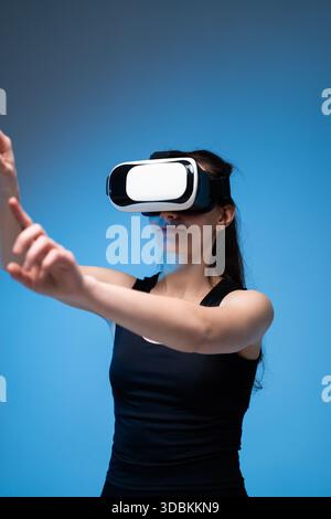 Woman uses a virtual reality headset to see the far corners of space ...