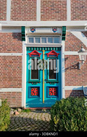 Colorful painted door in half-timbered house Stock Photo