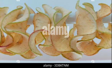 Dried apple slices as dried fruit on a stick Stock Photo