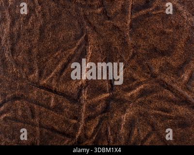 Abstract texture of synthetic leather, brown background. Stock Photo