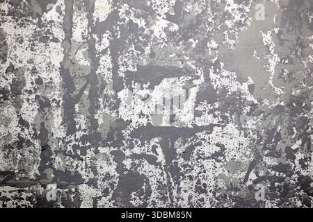The image showcases a detailed close-up of a textured wall, featuring a blend of gray and white tones that create an abstract and visually intriguing Stock Photo