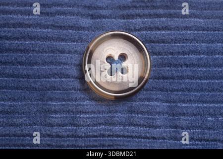 Close-up button on blue fabric Stock Photo