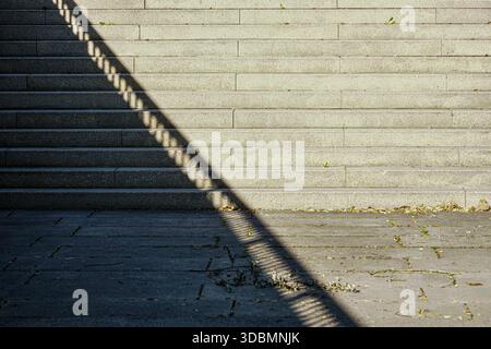 Ingolstadt, Germany, stairs, stone steps, railing shadow, optical illusion, light and shadow play, upward perspective Stock Photo