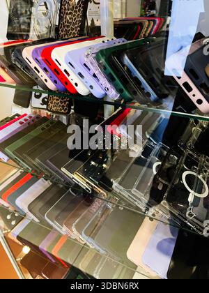 A vibrant variety of protective phone cases in different colors and styles on display today. Stock Photo