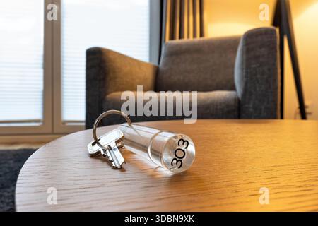 hotel or apartment key on table Stock Photo