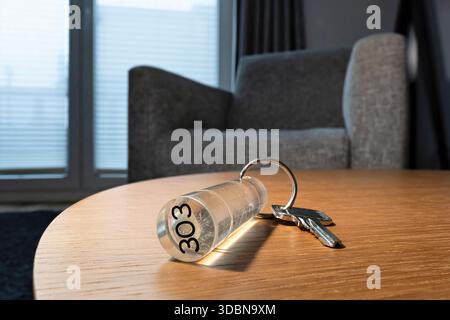 hotel or apartment key on table Stock Photo