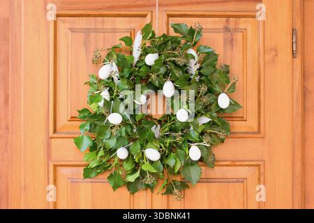 Natural green Easter ivy wreath on the door Stock Photo