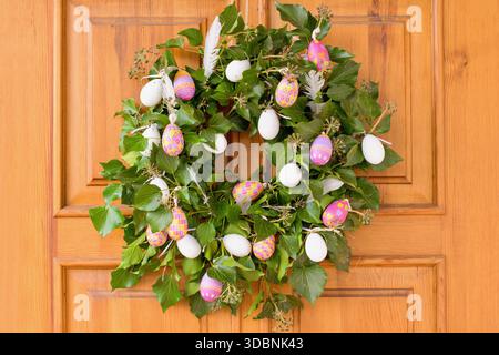 Natural green Easter ivy wreath on the door Stock Photo