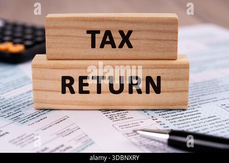 Tax Return text on wood block business concept Stock Photo