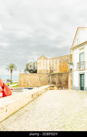 Historic stone city walls and traditional Portuguese architecture in Lagos, Algarve, Portugal. Stock Photo