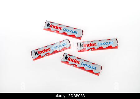 Multiple wrapped Kinder smooth milk chocolate bars  with a creamy filling on white background isolated Stock Photo