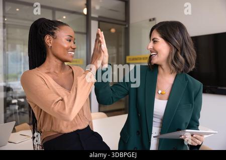 Happy multiethnic business colleagues closing important deal Stock Photo
