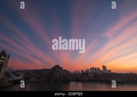 England, London, Tower Bridge and Cirrus Fibratus Cloud Formation Stock Photo