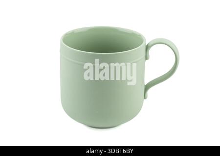 Green ceramic mug isolated on white background. Stock Photo