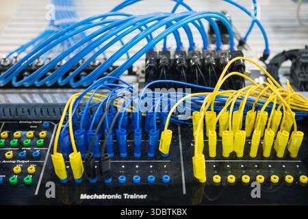 Control panel with blue and yellow wires Stock Photo
