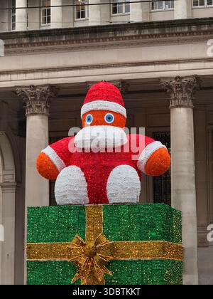 St Peter’s Square in Manchester City centre. Father Christmas decoration outside Central Library Stock Photo