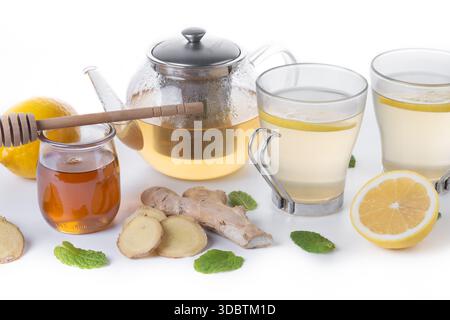 Ginger tea with honey and lemon in a cup isolated on white background Stock Photo