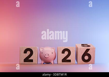 Financial Plan For 2026. A Small Piggy Bank Standing Between Wooden Blocks Displaying The Date. Concept For Savings, Investment, Budget Planning, And Stock Photo